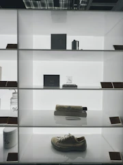 A finished product displayed elegantly on a minimalist shelf with soft lighting.