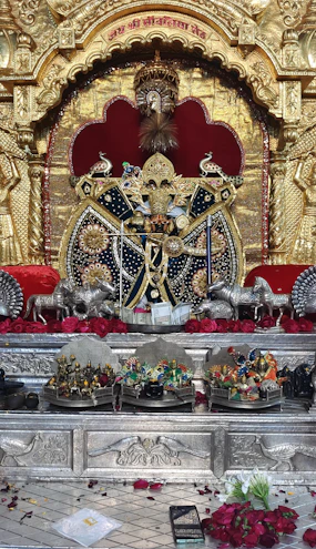 A dark elegant altar featuring a glowing Chintamani Yantra surrounded by golden sacred geometry patterns.