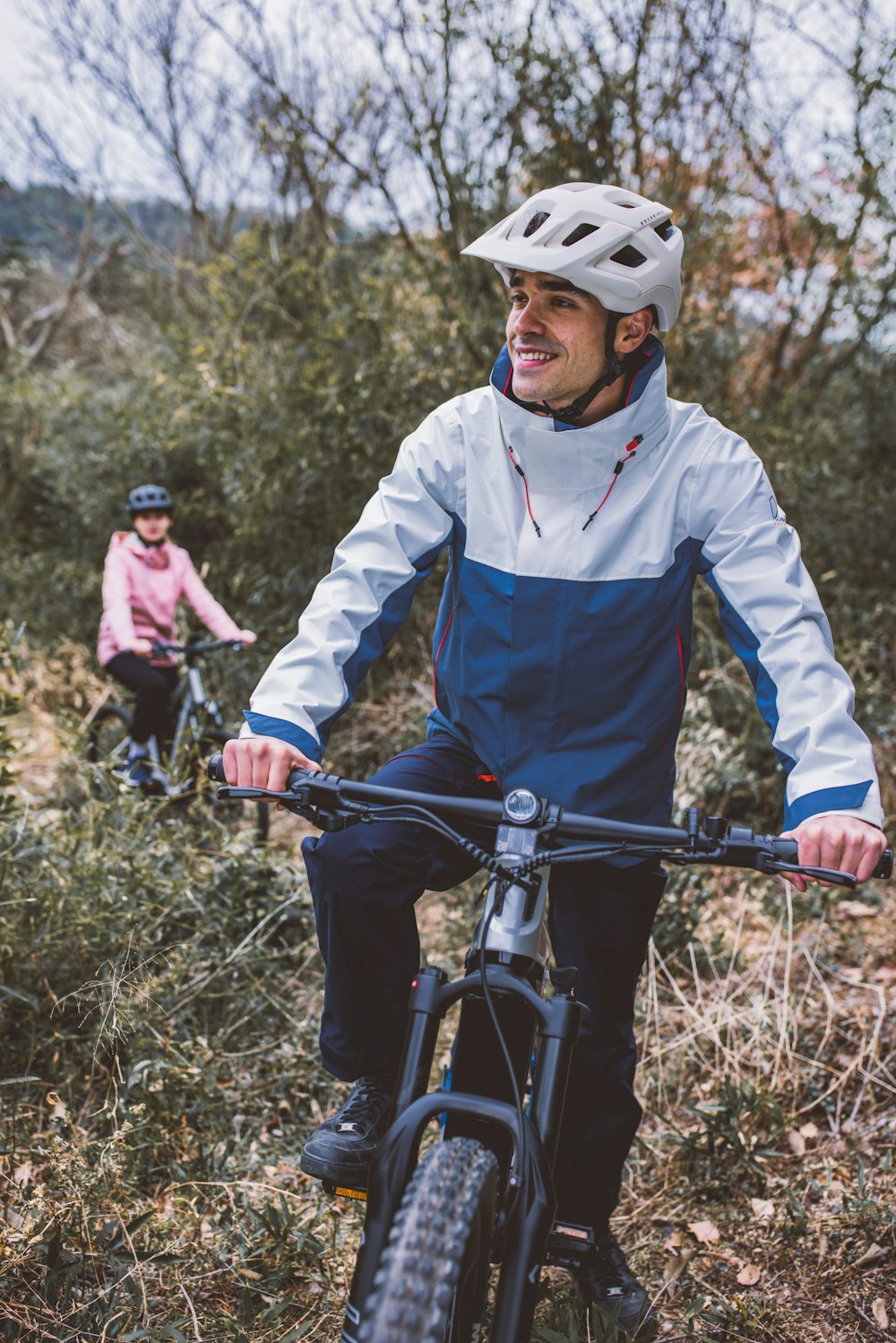 a man riding a bike while wearing a helmet