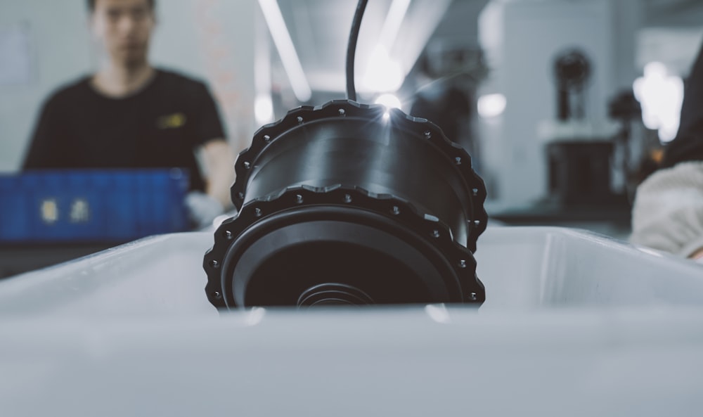 a man working on a machine in a factory