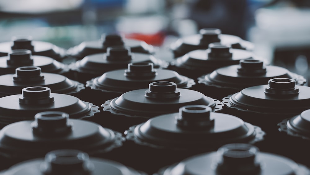 a close up of a bunch of black and white flasks