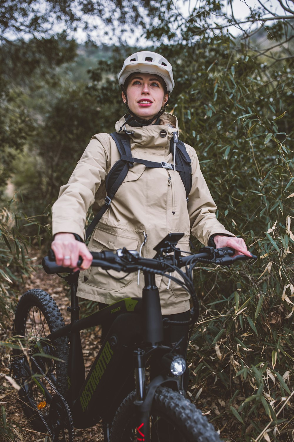 a person riding a bike on a trail