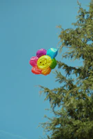 A child receiving a colorful balloon at a special smile campaign event.