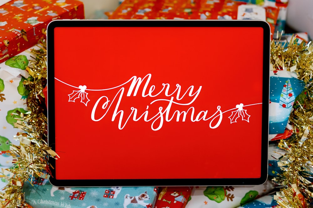 a red box with merry christmas written on it