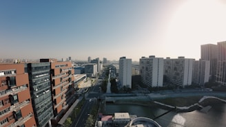Aerial shot of a contemporary apartment complex in a vibrant city.