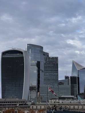 A panoramic view of a bustling city skyline representing the UK locations we serve.