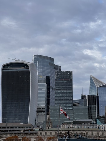 A scenic view of the Riverside city skyline with a British flag subtly waving in the foreground.