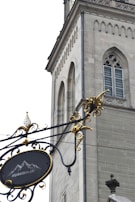 An inviting medieval-style sign encouraging visitors to become sponsors.