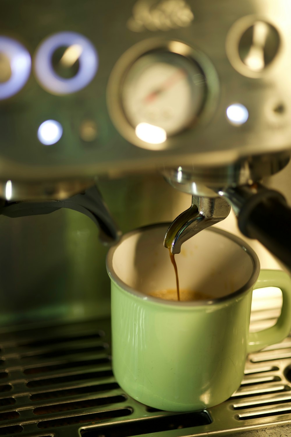 a cup of coffee being filled with liquid