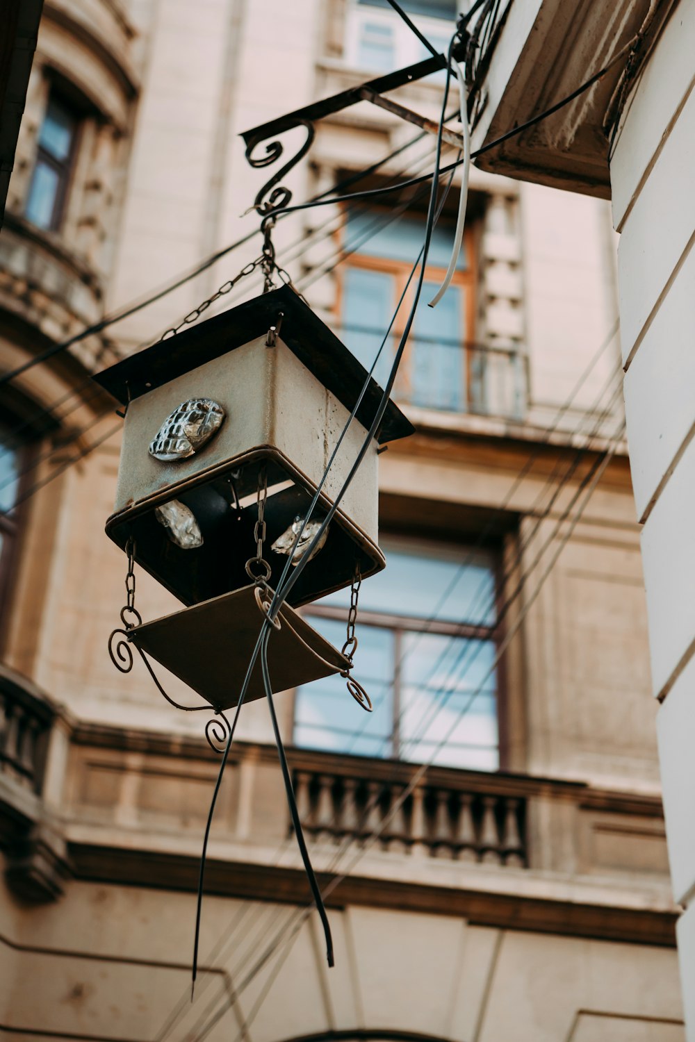 a clock hanging from the side of a building