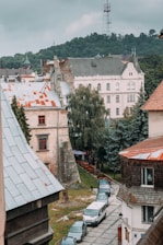 A scenic view of a small town with satellite dishes on rooftops, symbolizing connectivity.