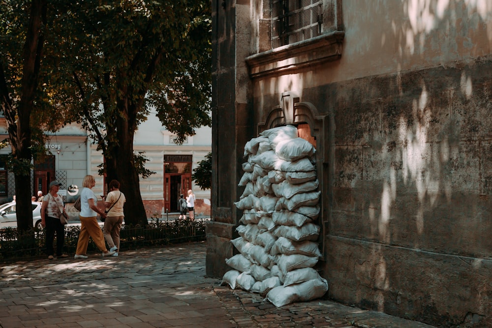 a pile of sandbags sitting on the side of a building