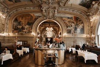 a restaurant with a large painting on the wall