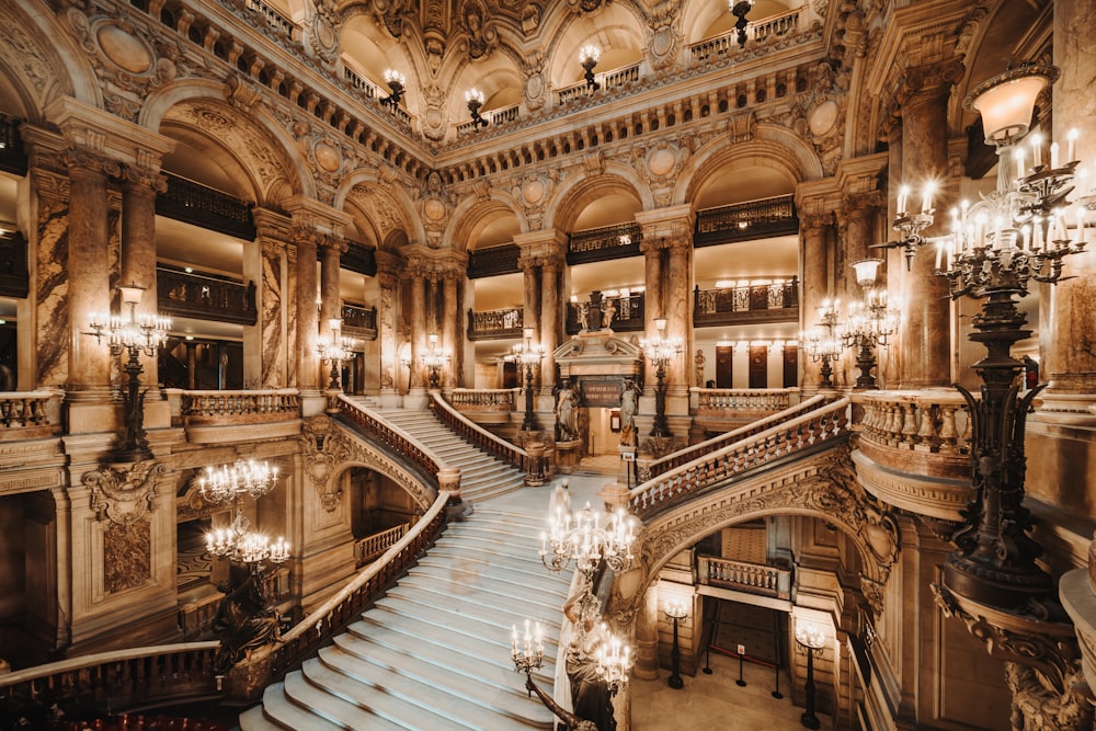 a grand staircase with chandeliers and chandeliers