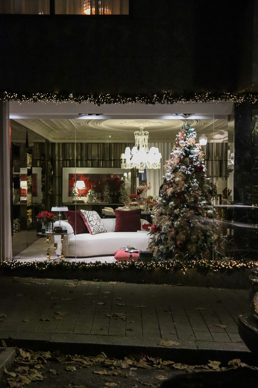 a living room filled with furniture and a christmas tree