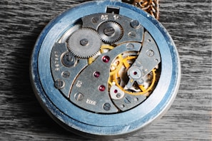 Intricate gears of a classic watch movement exposed during detailed diagnostics.