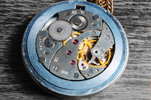 Close-up of a vintage watch mechanism with intricate gears and springs.