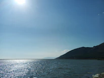 A serene landscape photo with expansive sky and natural light.