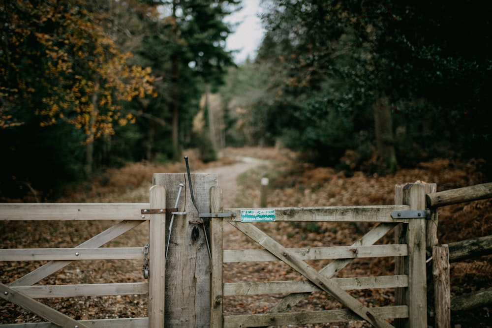 a wooden gate with a sign on it