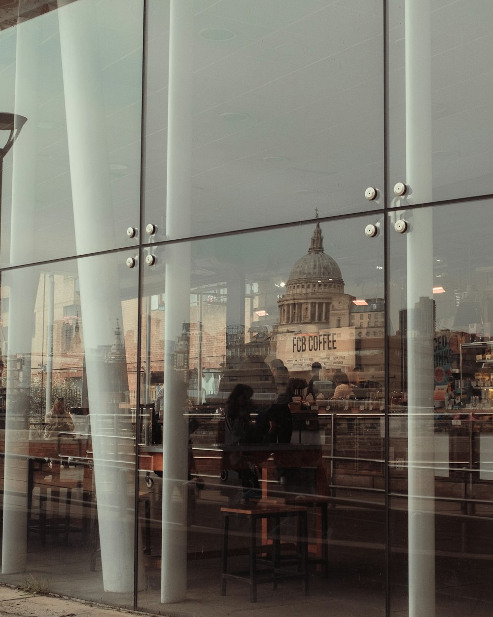 a reflection of a building in a glass window