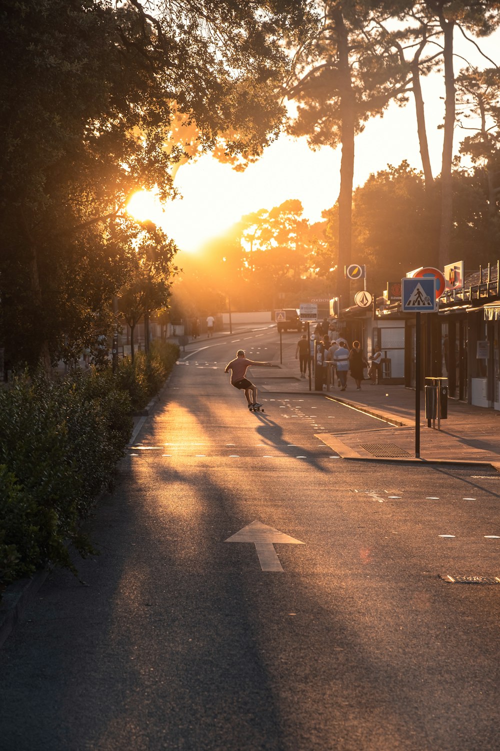 a person riding a skateboard down a street