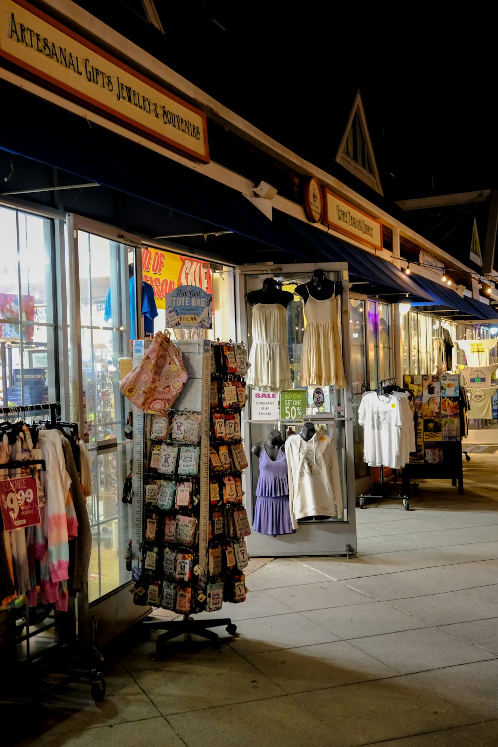 a store front with clothing on display in front of it