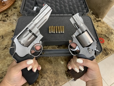 The Automag pistol displayed in a protective case.