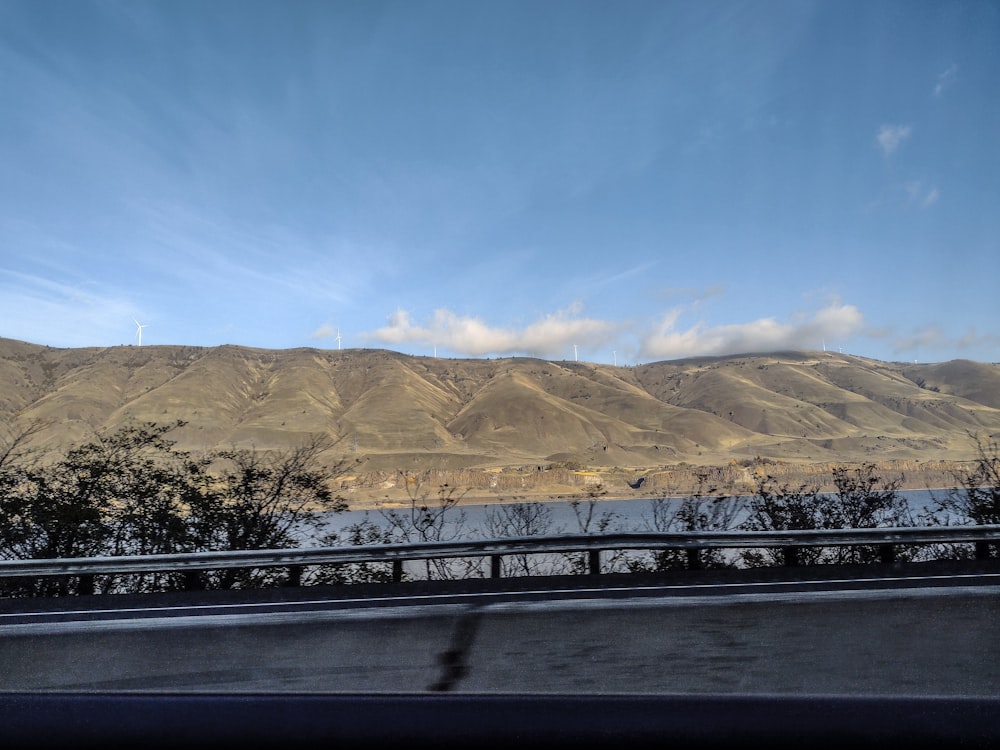 a view of a mountain range from a highway