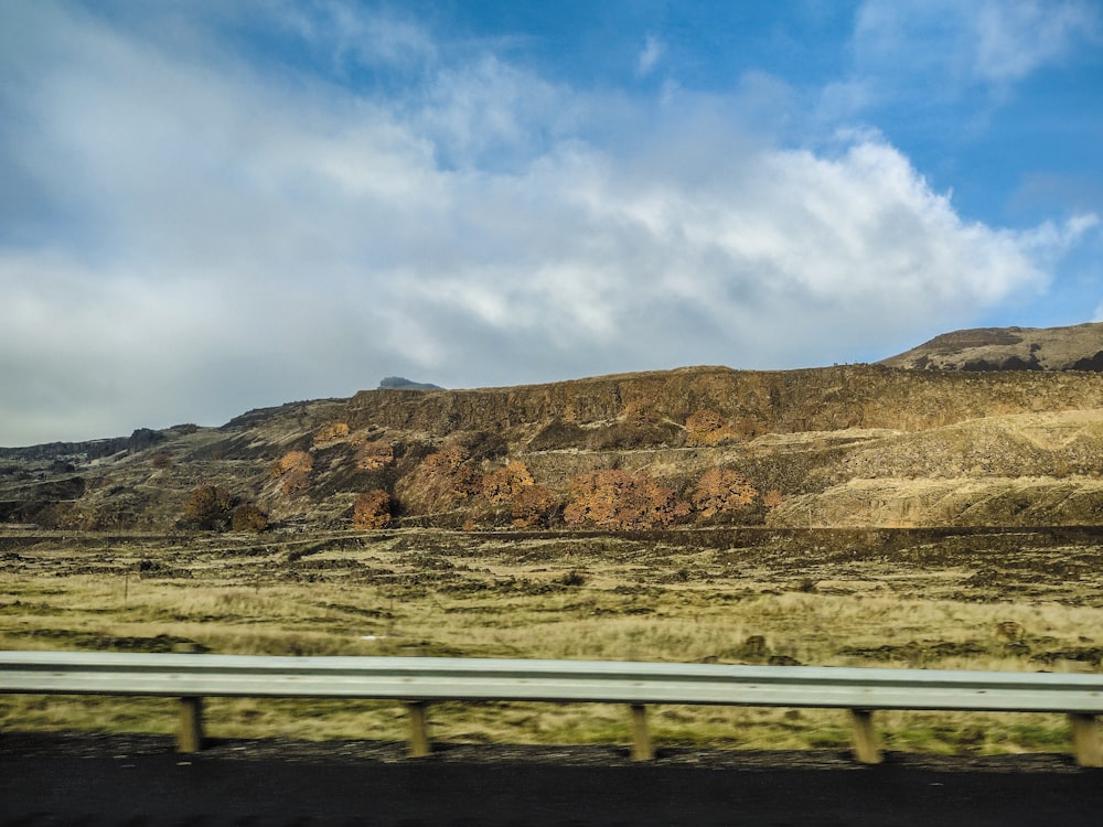 a view of a mountain from a moving car