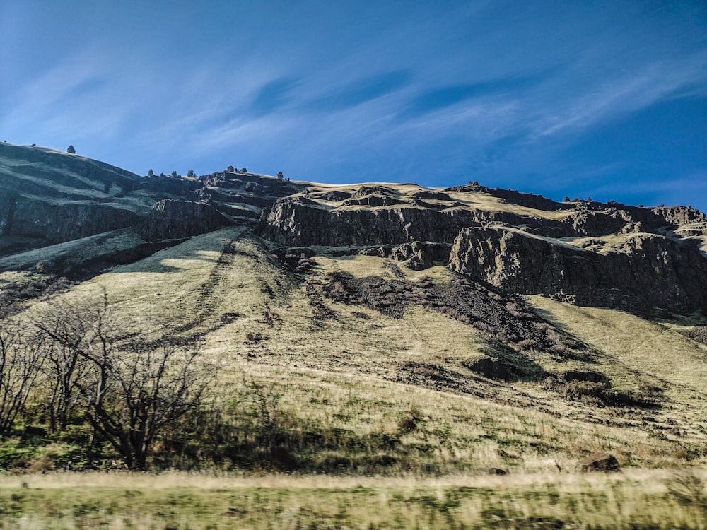 a view of a mountain from a moving vehicle