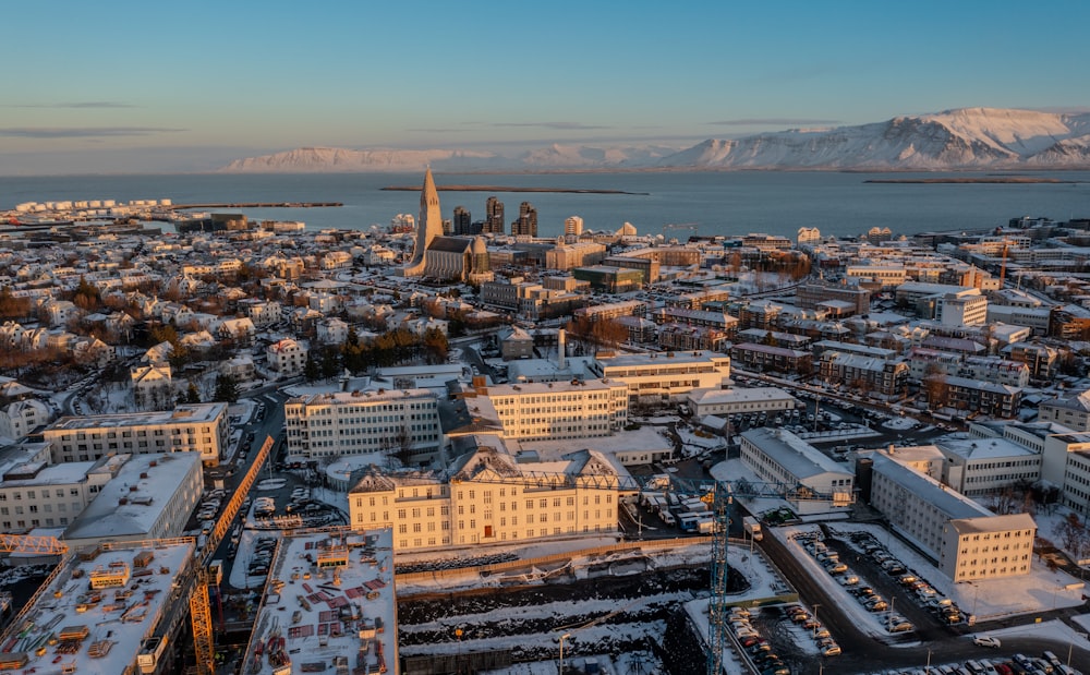 an aerial view of a city with snow on the ground