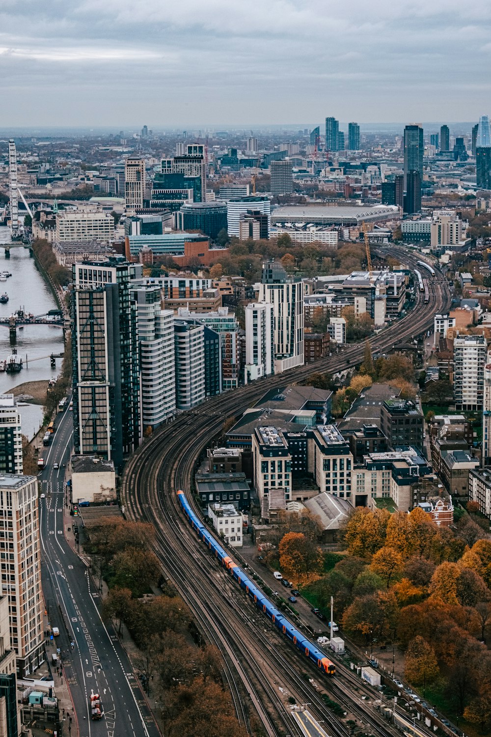 a view of a city with a train on the tracks