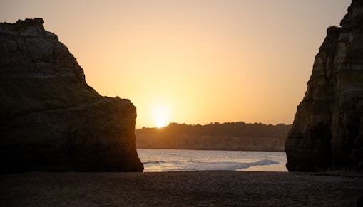A beautiful gold-framed view of a California coastline at sunset.