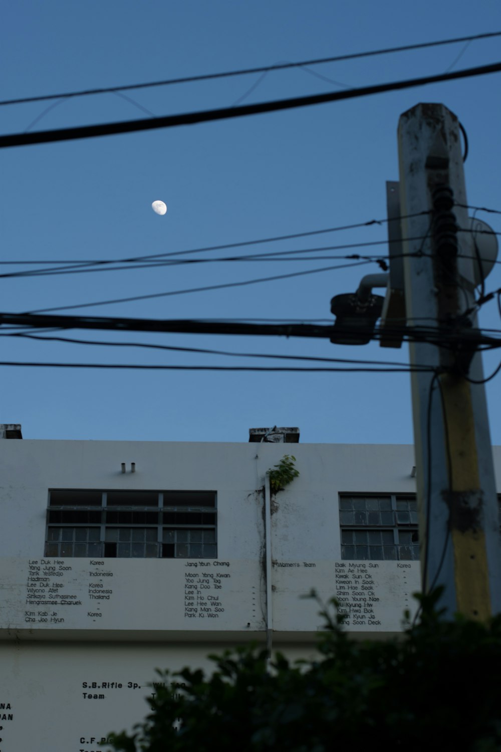 a building with a full moon in the background