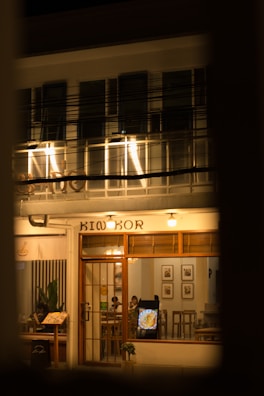 Night view of a warmly lit Munich restaurant with inviting atmosphere.