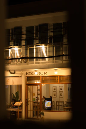 A cozy artisanal restaurant bathed in warm light, captured in a 360-degree virtual tour.