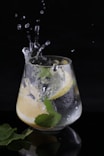 a glass filled with water and a lemon slice