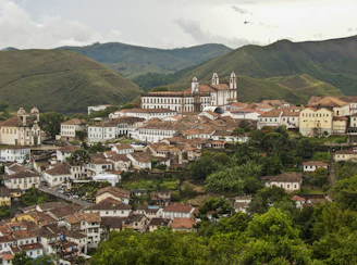 A panoramic view of a historic colonial town with cobblestone streets.
