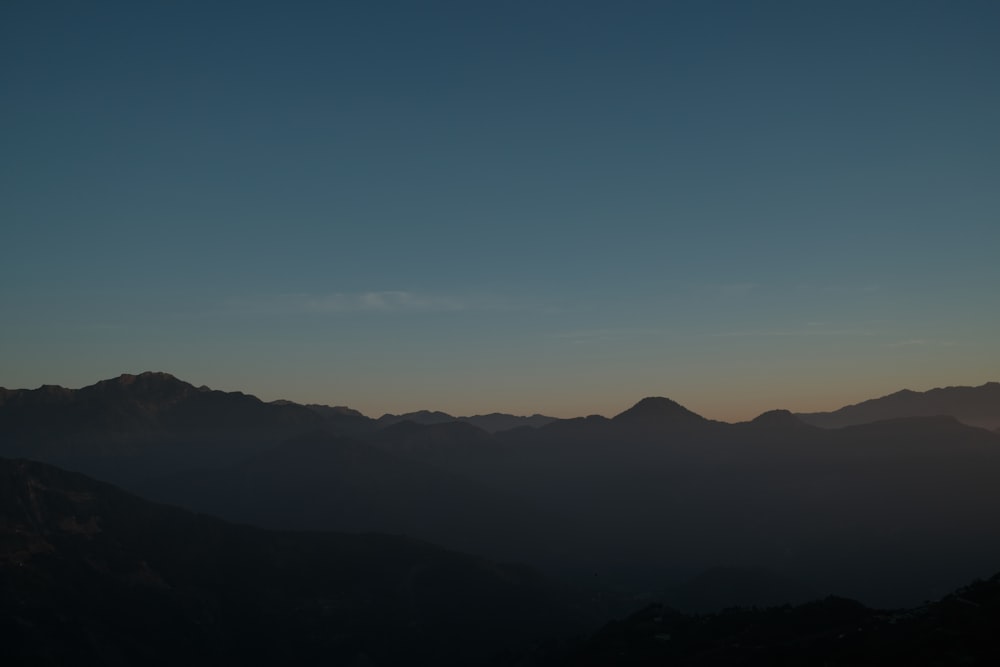 a view of a mountain range at sunset