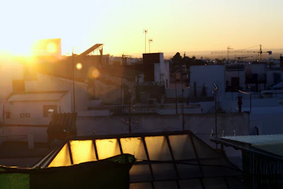 A rooftop view overlooking Chennai’s skyline at sunset with gold accents.