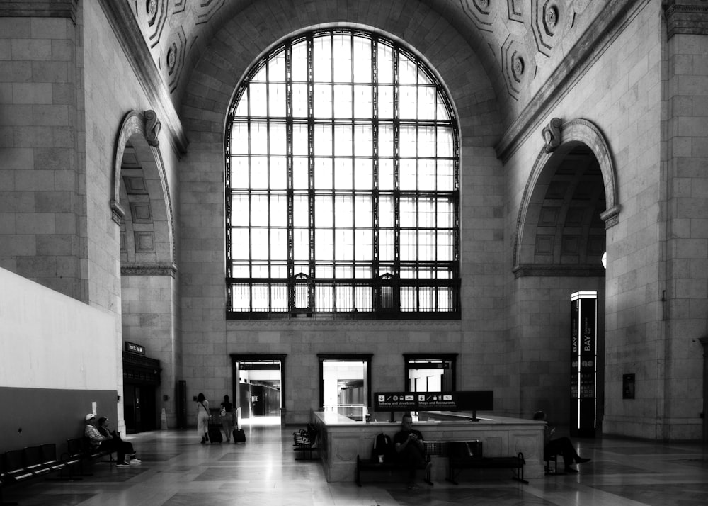 a black and white photo of a train station