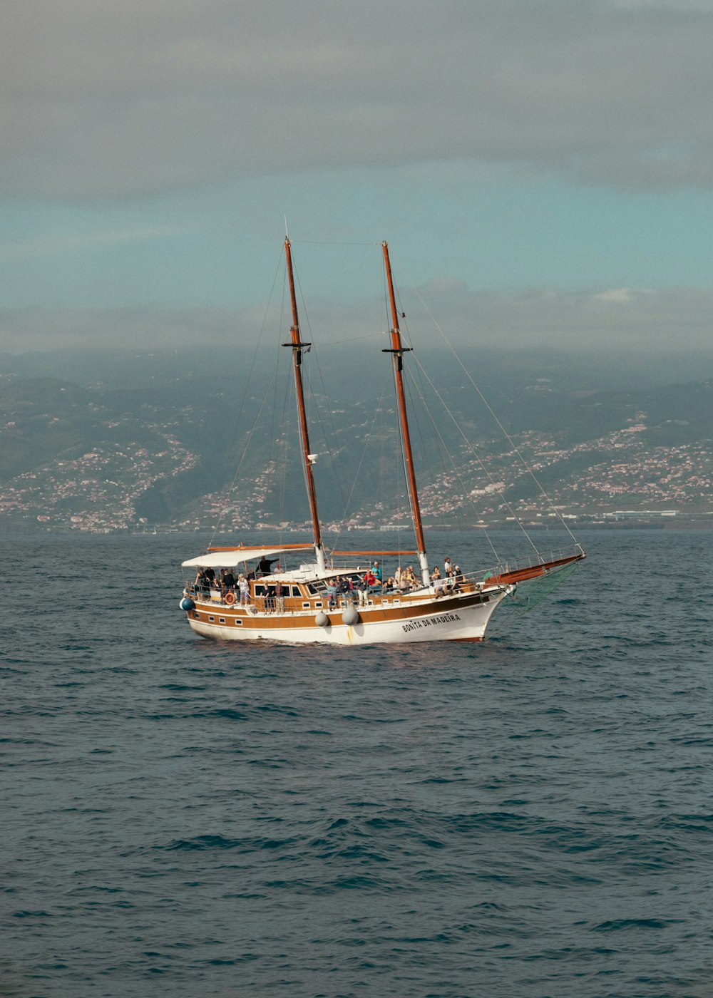 a sailboat in the middle of a body of water