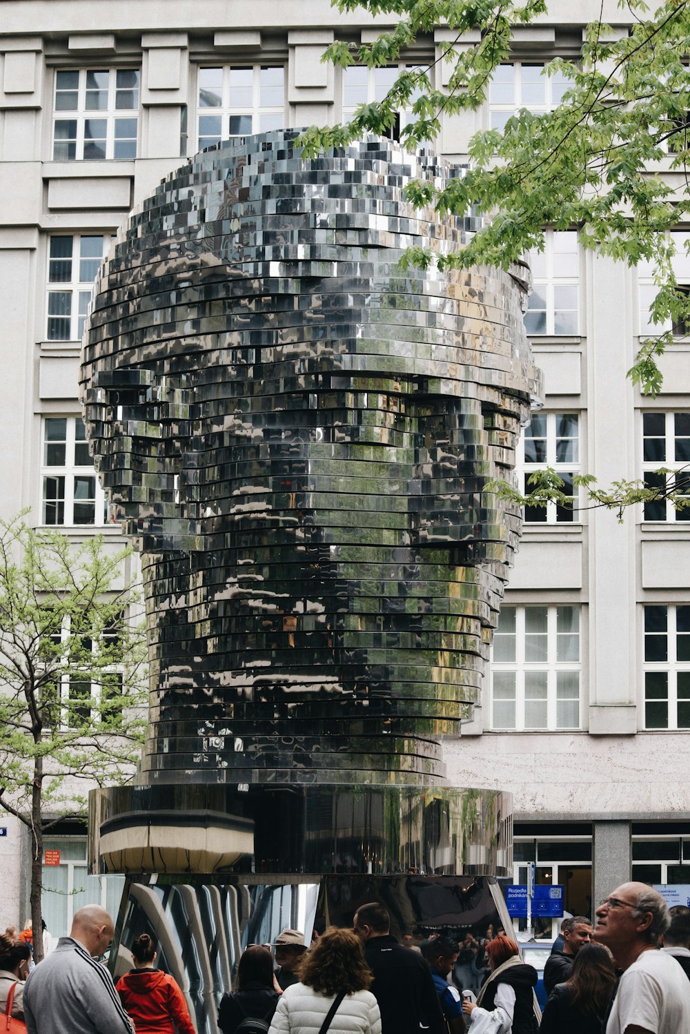 a group of people standing in front of a building