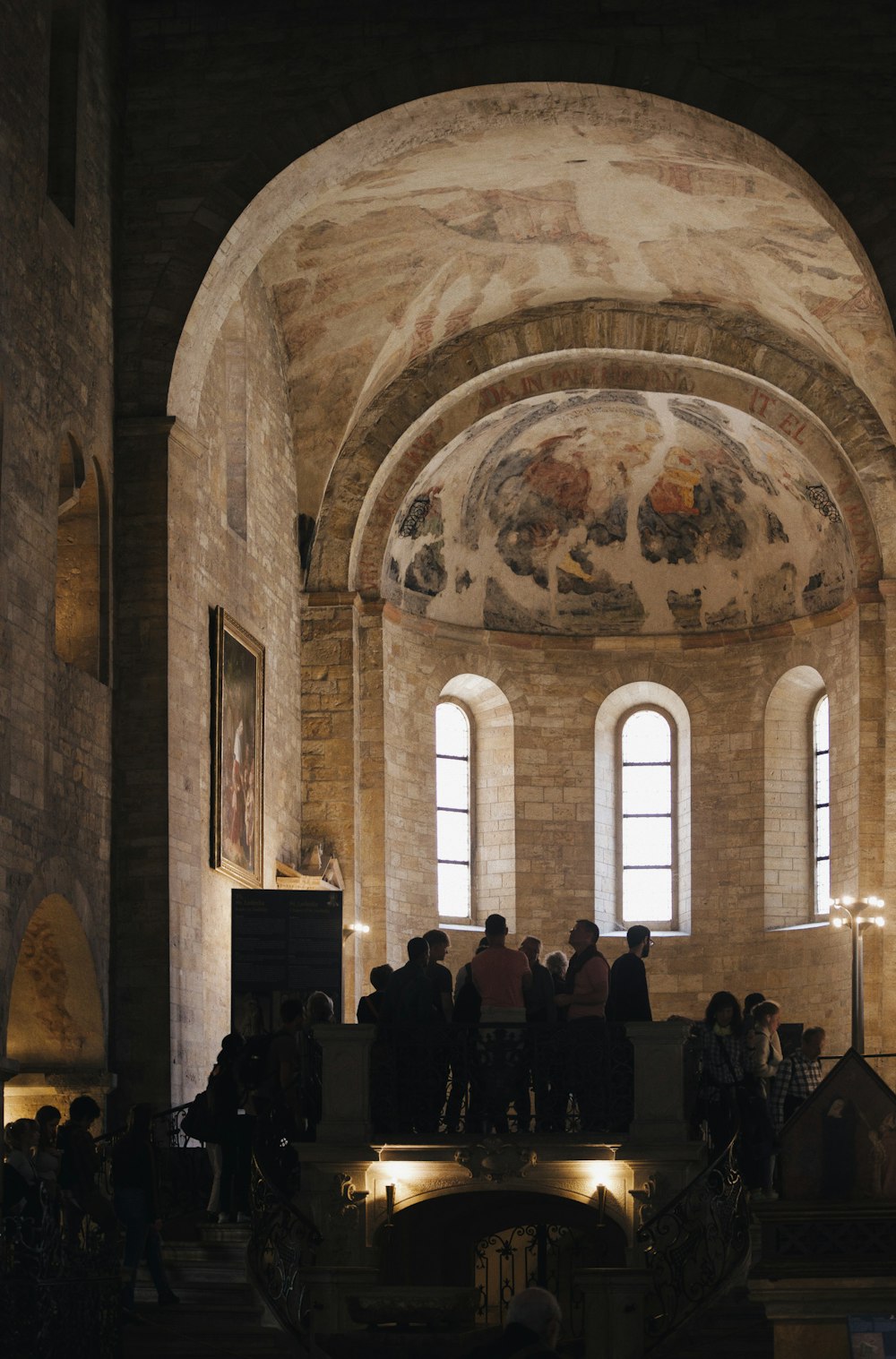 a group of people standing in a large room