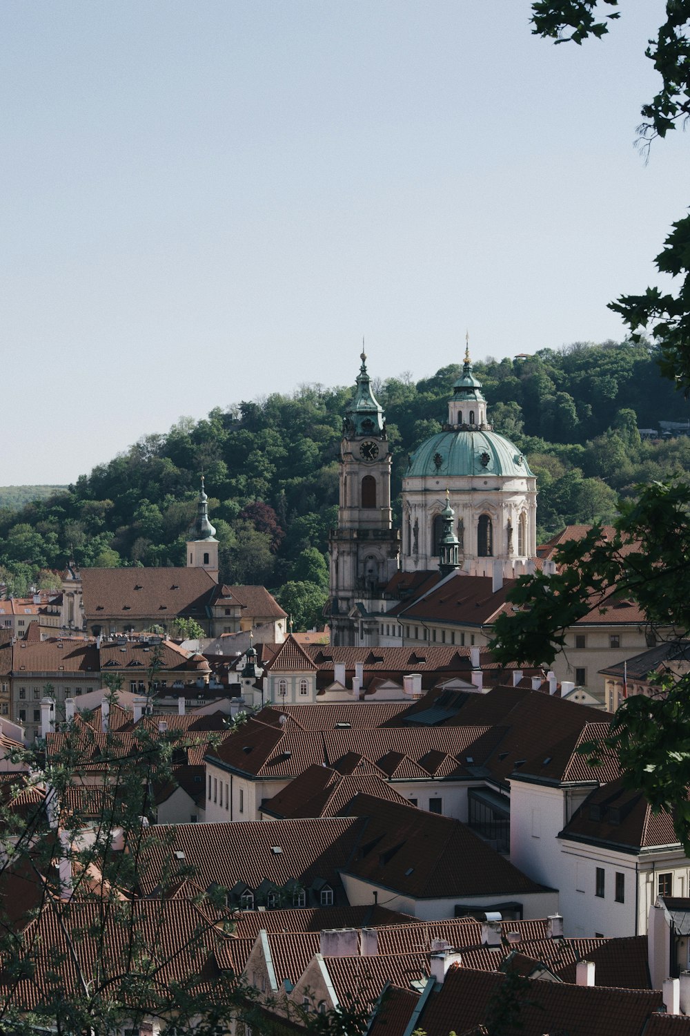 a view of a town with a church on top of it