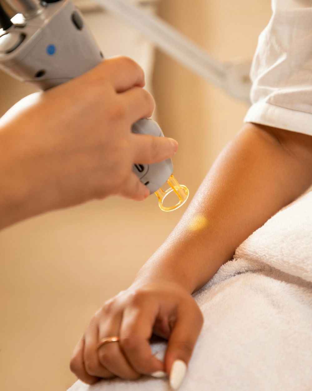 a woman getting her nails done at a nail salon