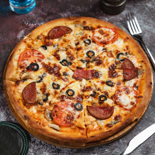 a pizza sitting on top of a wooden cutting board