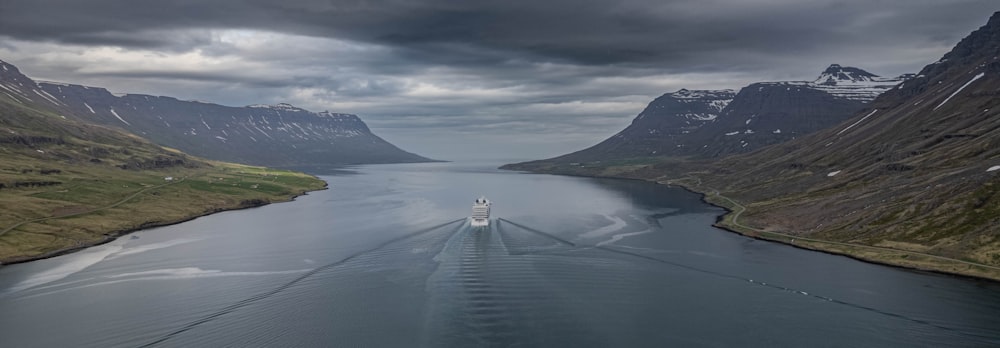 a boat traveling through a large body of water
