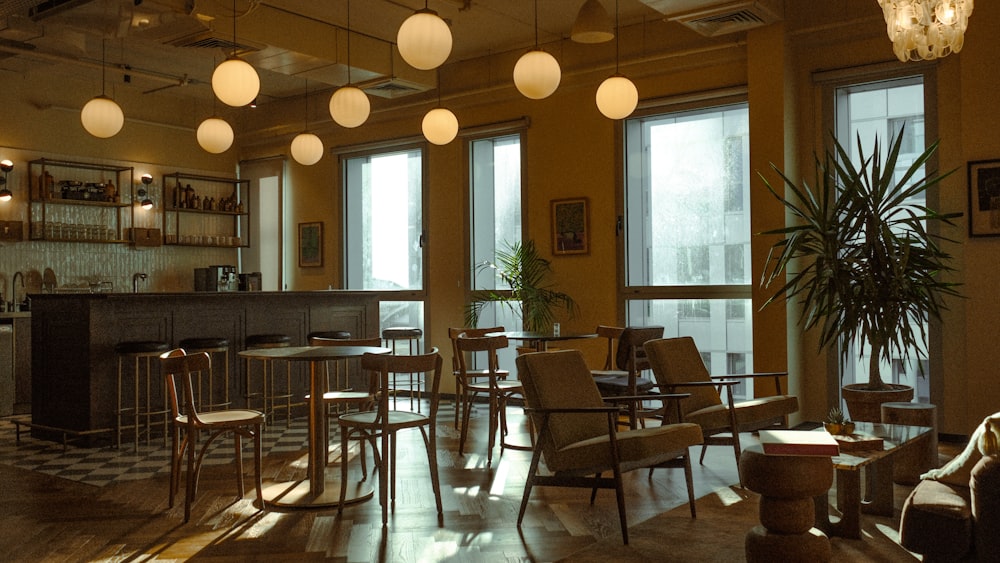 a restaurant with a bar, chairs, and a checkered floor