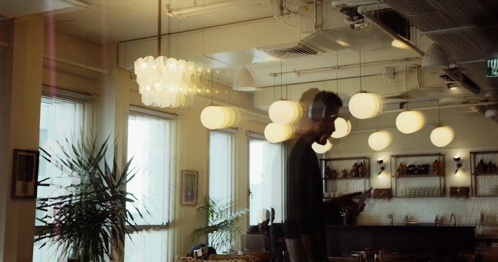 a blurry photo of a person standing in a room